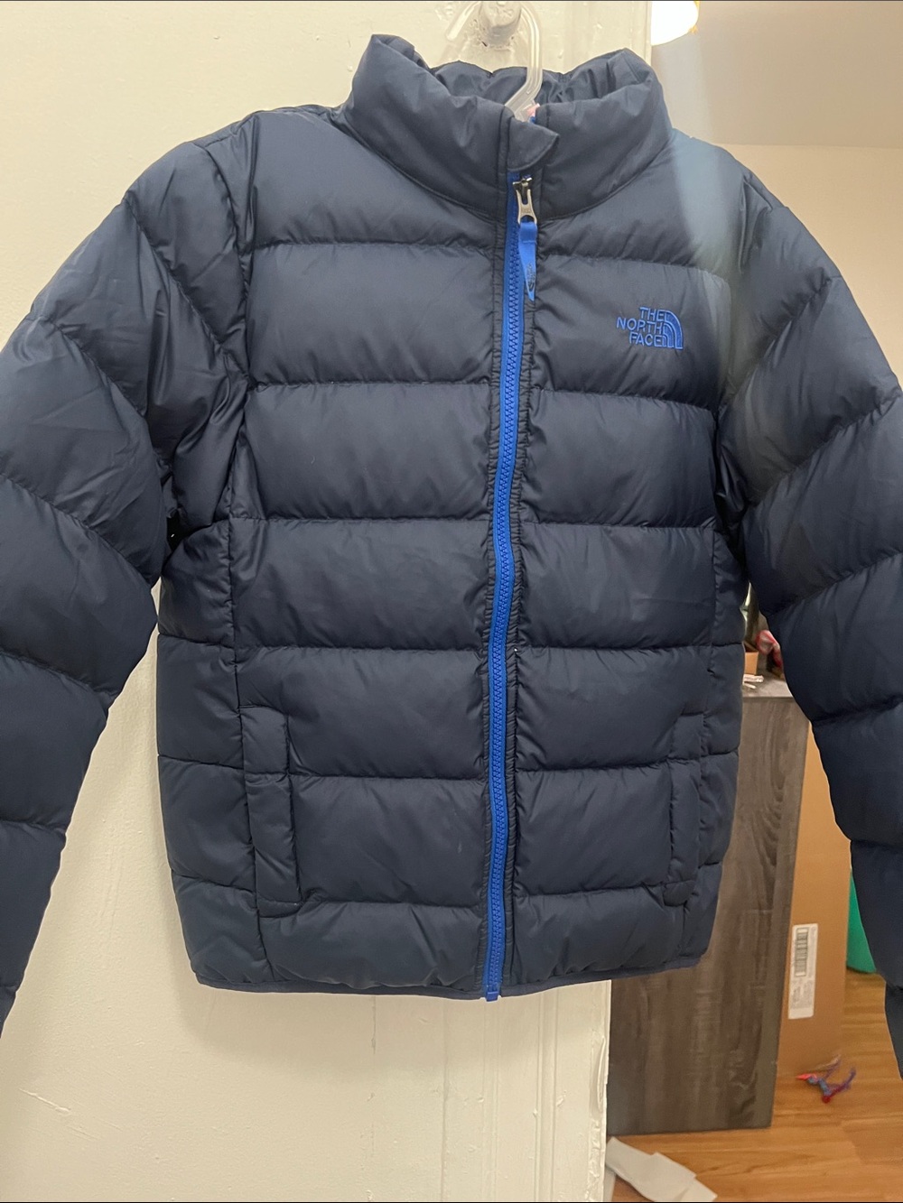 The North Face Kids Navy Blue Puffer Jacket with Bright Blue Zipper